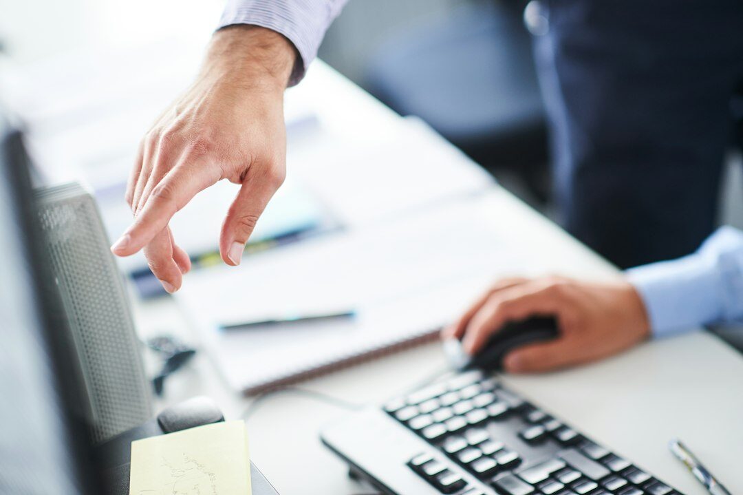 person reviewing insurance policy on computer
