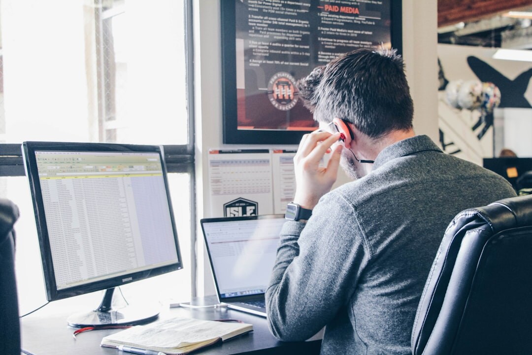 software developer writing code at desk