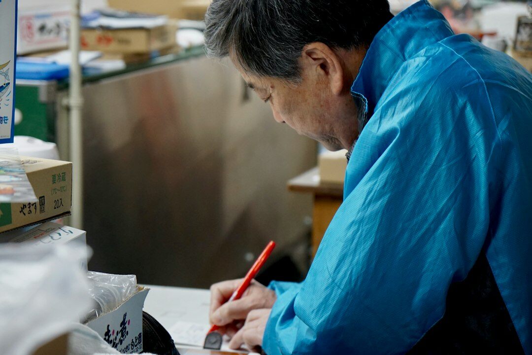 Analyst reviewing underwriting risk charts and data tables on a desktop monitor