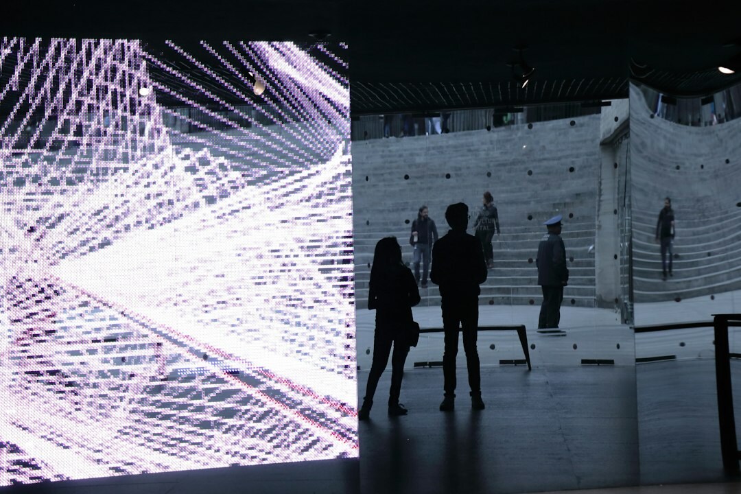 Software developers reviewing system architecture diagrams on a large screen